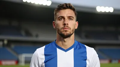 A 30-year-old, athletic, anonymous left-back in a Le Mans FC kit (blue and white stripes, made of a smooth, high-quality...