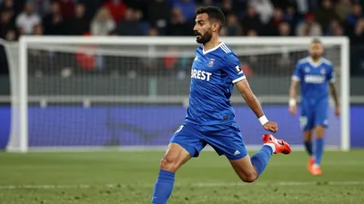 A photo of Adil Bourabaa, Le Mans FC midfielder, scoring a goal against Brest, taken with an 85mm f/1.4 lens, with a...
