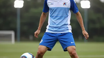 A photorealistic image of an anonymous player in a Le Mans FC jersey, with a blue and white striped shirt and blue...